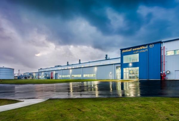 Exterior of Lufthansa Technik Heavy Maintenance Facility at dusk.